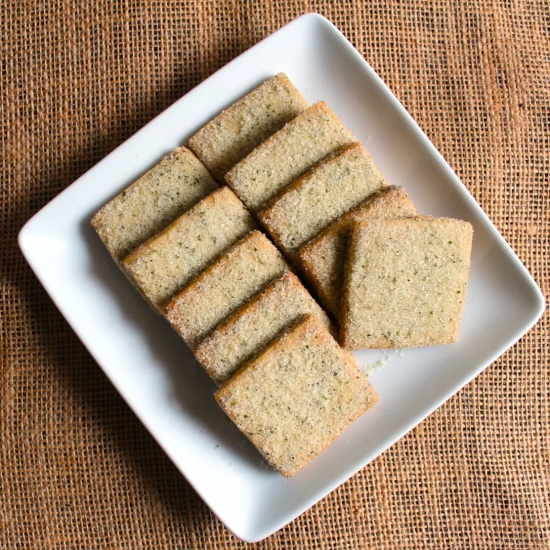 A white square plate of Lemon Verbena Earl Grey Thins Cookies