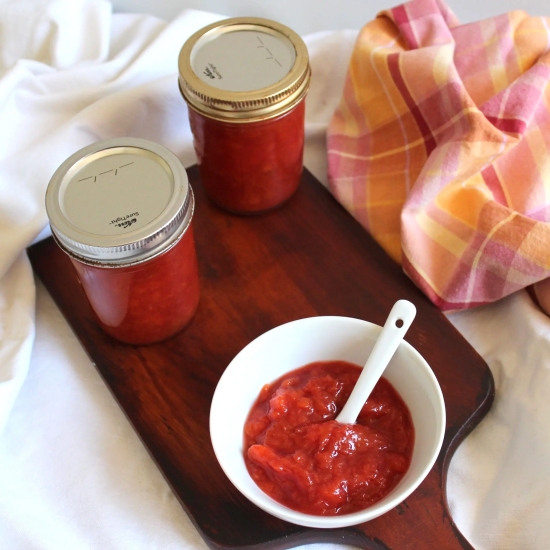 A dish and two jars of nectarine jam