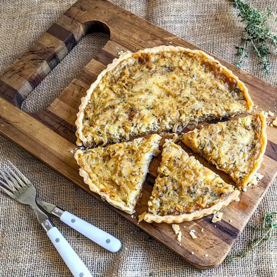 An Onion Tart with 3 slices cut out
